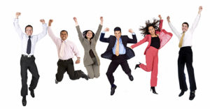happy group of business people jumping - isolated over a white background