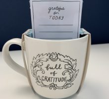 coffee mug that says full of gratitude on it