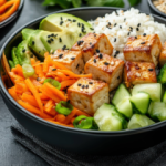 bowl with tofu, cucumbers, rice, carrots
