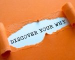 orange paper with tear revealing discover your why