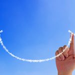 blue sky with smile face line and hand